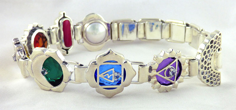 crystal healing jewelry made with quartz crystals and chakra design