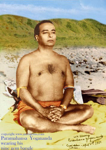 Paramahansa Yogananda meditating on the beach wearing nine gem bangles